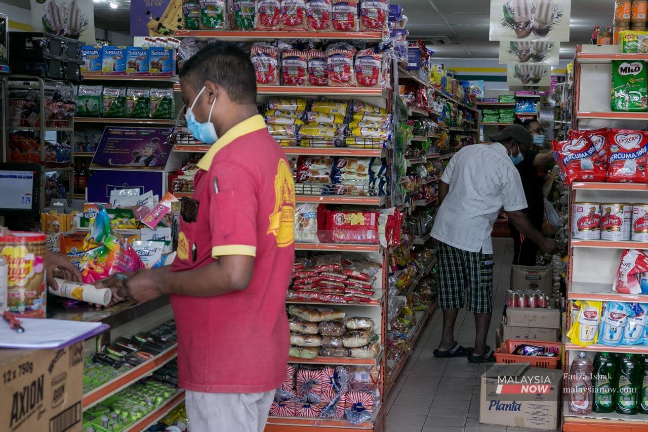 Residents in Klang stock up on food and other supplies ahead of the conditional movement control order which will take effect from midnight.