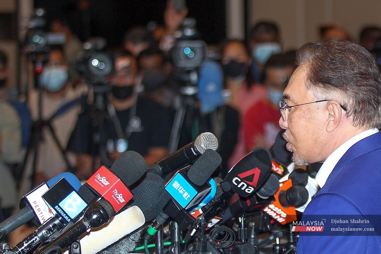 PKR president Anwar Ibrahim speaks at a press conference after his audience with the Yang di-Pertuan Agong.