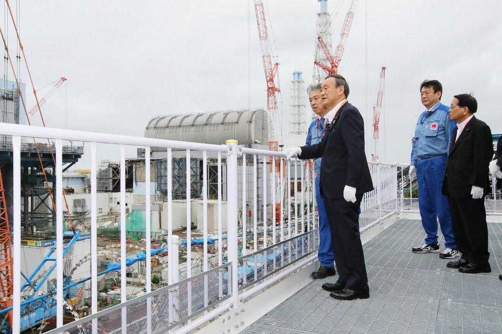 Japan's Prime Minister Yoshihide Suga (front) visits the Fukushima Daiichi nuclear power station in Okuma, Fukushima prefecture on Sept 26. Photo: AFP