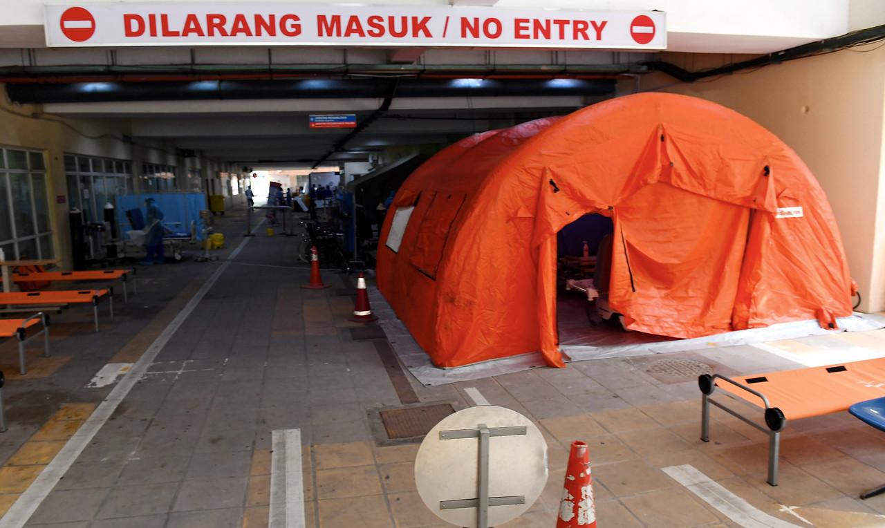 Tents set up outside the Queen Elizabeth Hospital to accommodate the growing number of Covid-19 cases in the state. Photo: Bernama
