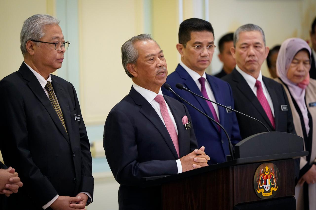 Prime Minister Muhyiddin Yassin (second left) at a press conference after his first Cabinet meeting on March 11. With him is senior minister Mohamed Azmin Ali (centre). Photo: AP