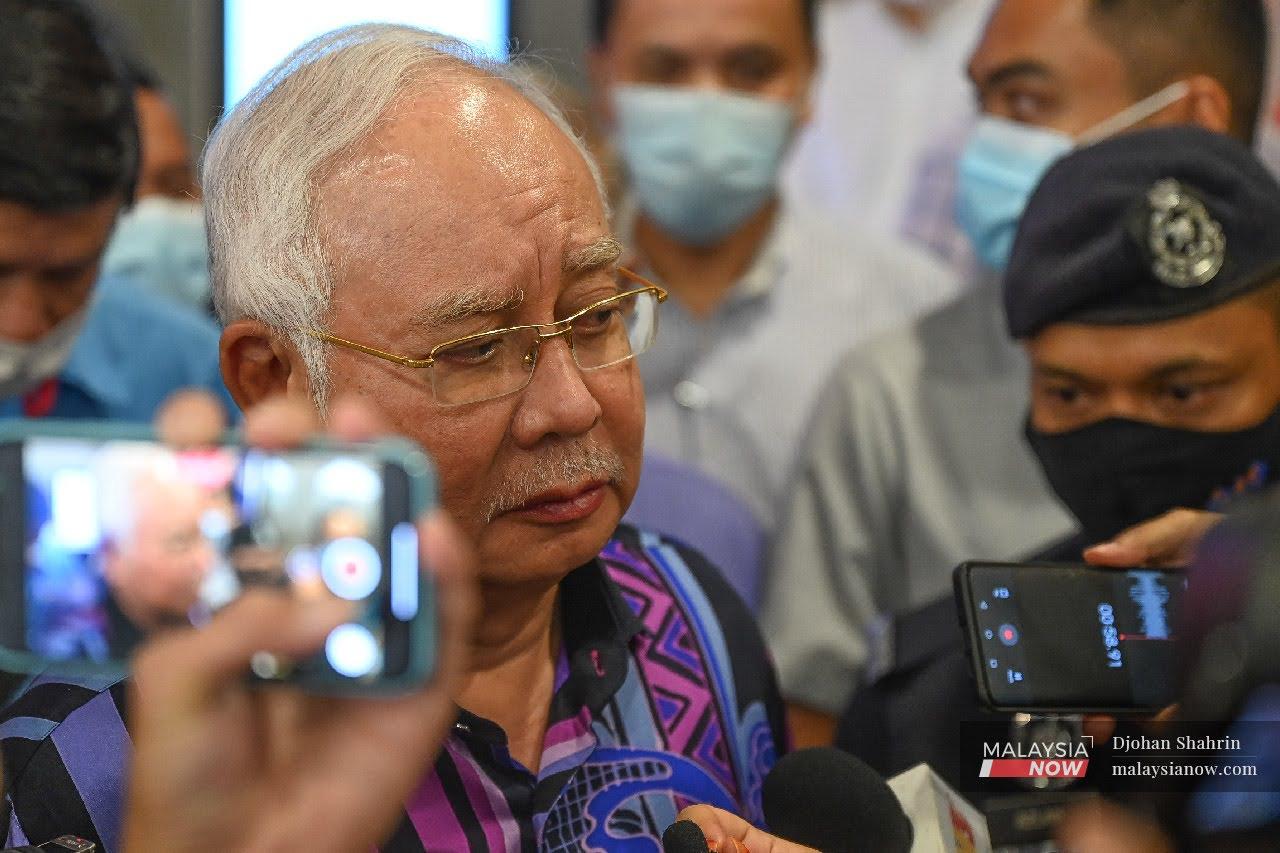 Former Umno president Najib Razak leaves after a meeting of Barisan Nasional MPs at PWTC in Kuala Lumpur today.