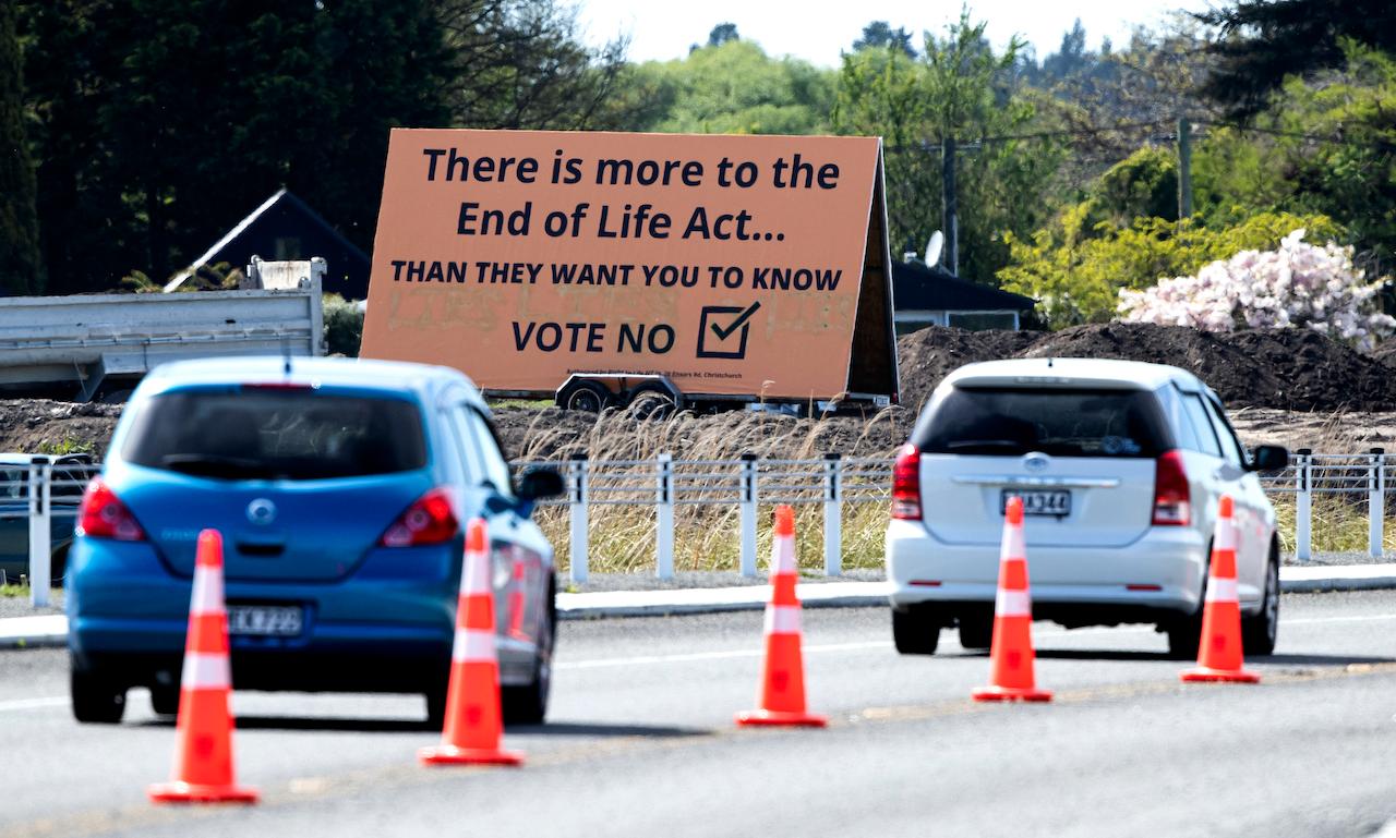 Cars in Christchurch, New Zealand pass a billboard urging voters to vote against euthanasia on Oct 16. Photo: AP