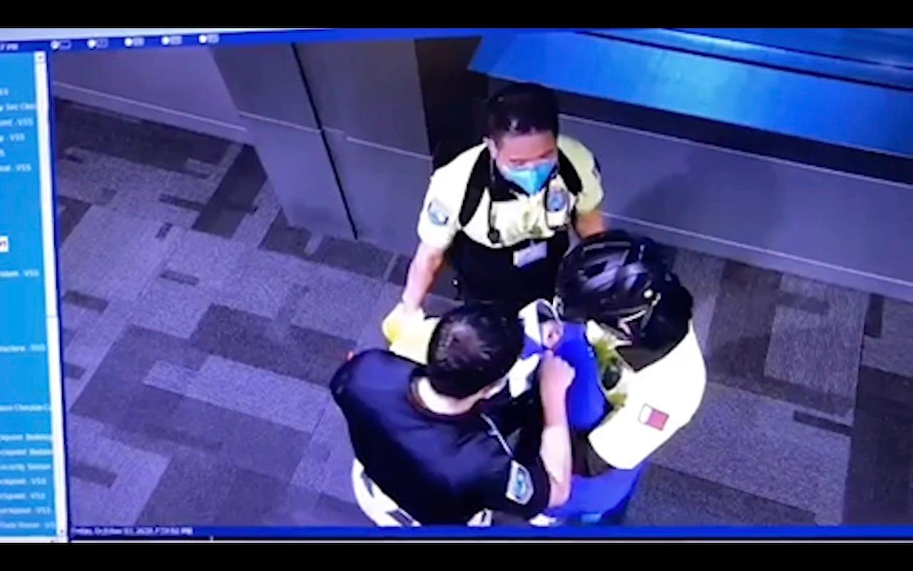 This image made from Oct 2 surveillance camera footage obtained by the website Doha News shows officials caring for an abandoned baby at Hamad International Airport in Doha, Qatar. Photo: AP