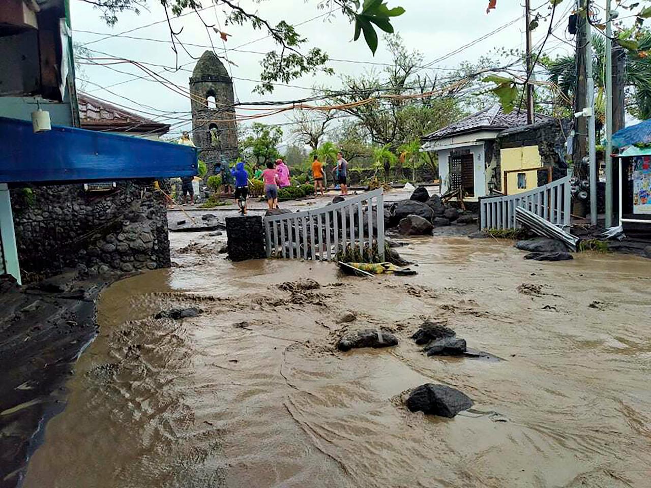 Floodwaters pass by Cagsawa ruins, a famous tourist spot in Daraga, Albay province, central Philippines as typhoon Goni hit the area on Nov 1. Photo: AP