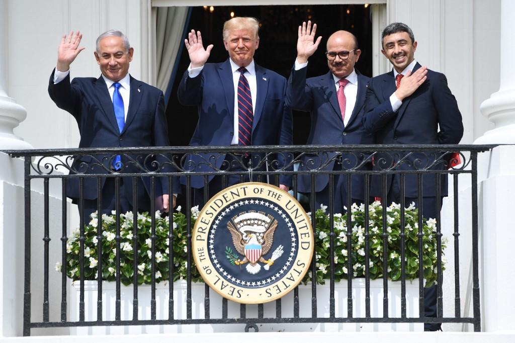 (Left to right )Israeli Prime Minister Benjamin Netanyahu, US President Donald Trump, Bahrain Foreign Minister Abdullatif al-Zayani, and UAE Foreign Minister Abdullah bin Zayed Al-Nahyan wave after signing the Abraham Accords normalising ties between the Jewish and Arab states. Photo: AFP