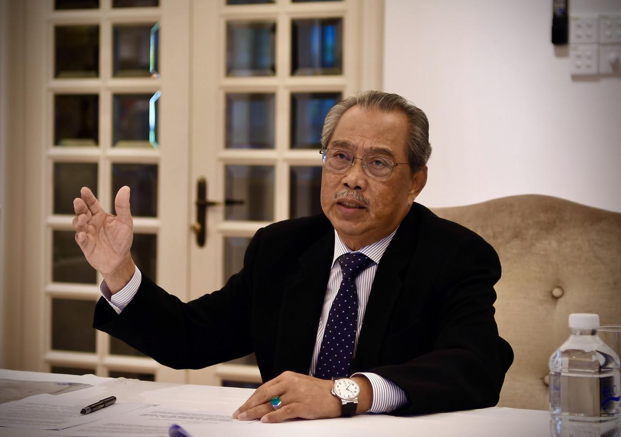 Prime Minister Muhyiddin Yassin speaks in a press conference through teleconferencing at his residence in Kuala Lumpur today. Photo: Bernama