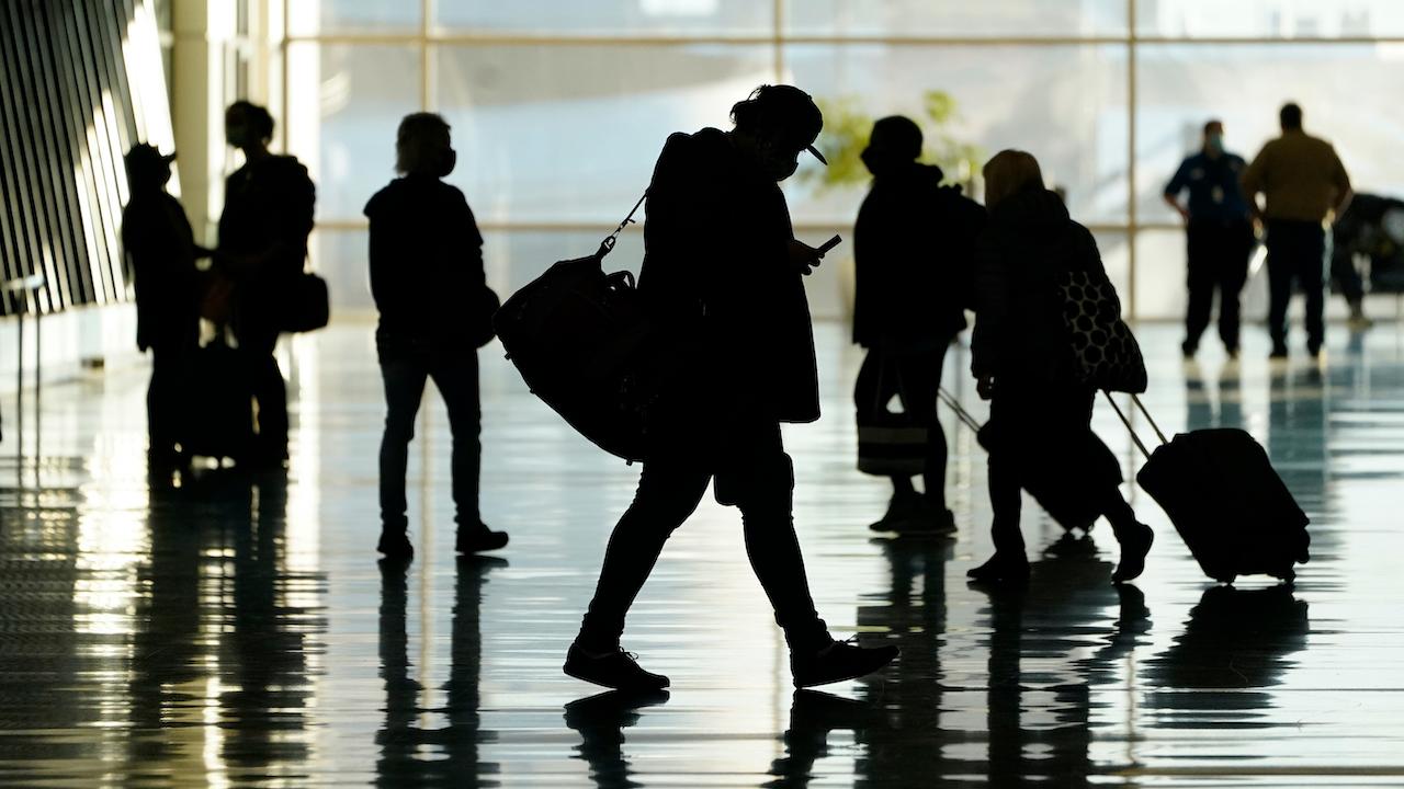 Passengers walk through Salt Lake City International Airport in this picture taken on Oct 27. Photo: AP.
