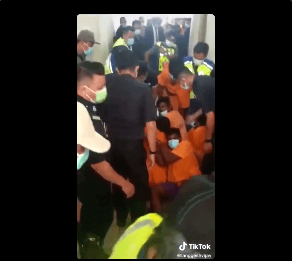 A screenshot of the scuffle in the corridor outside the courtroom.