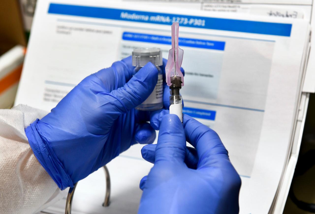 A nurse prepares a shot that is part of a possible Covid-19 vaccine developed by the National Institutes of Health and Moderna Inc in Birmingham, New York. Photo: AP