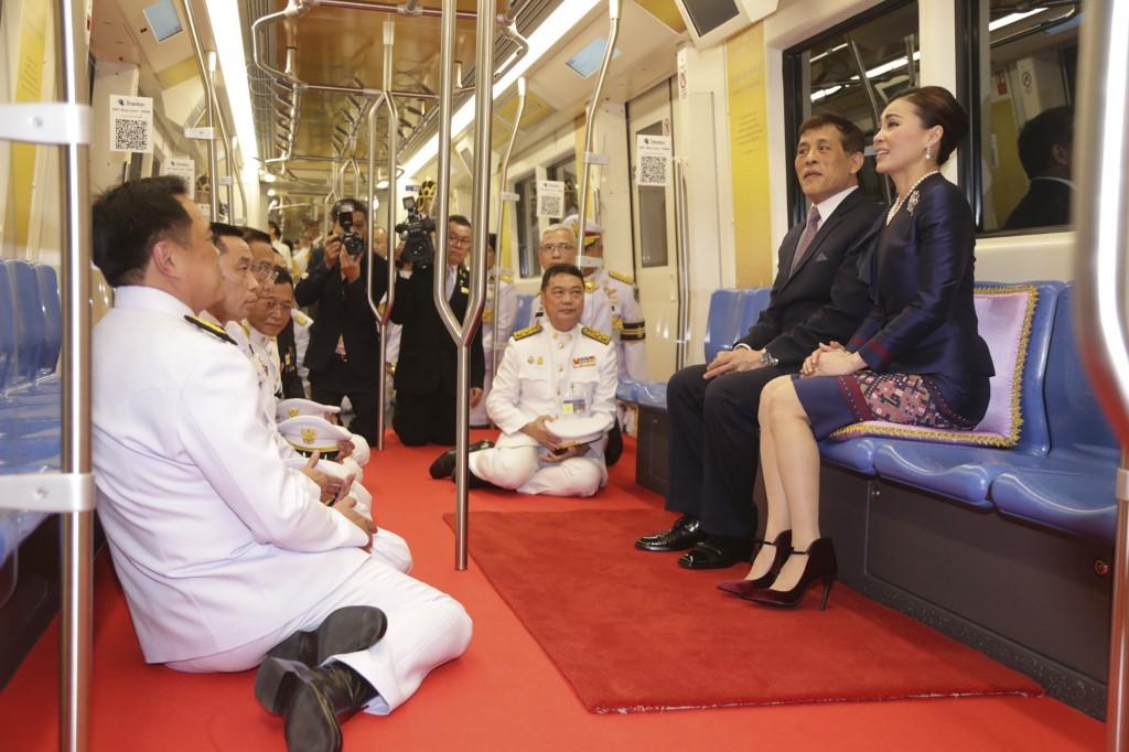 Thailand's King Maha Vajiralongkorn (second right) and Queen Suthida (right) ride with officials on an MRT commuter train during the inauguration of a new subway station in Bangkok on Nov 14. Photo: AFP