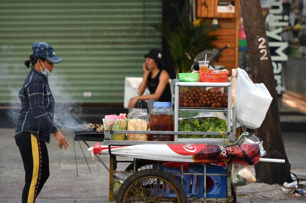A street food vendor sells spring rolls and grilled meat in Ho Chi Minh city, Vietnam, Sept 8. Photo: AFP