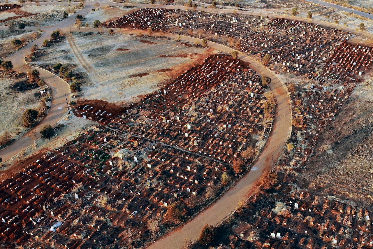 An aerial view of recently filled graves at a cemetery outside Johannesburg, South Africa on Aug 5. Photo: AP