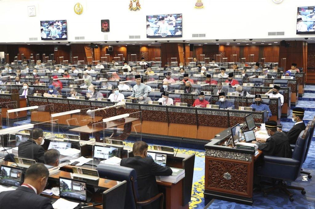 MPs fill the Dewan Rakyat during the tabling of the 2021 budget. Law minister Takiyuddin Hassan says there are no provisions for procedures related to motions of no confidence in either the constitution or the Dewan Rakyat Standing Orders. Photo: AP
