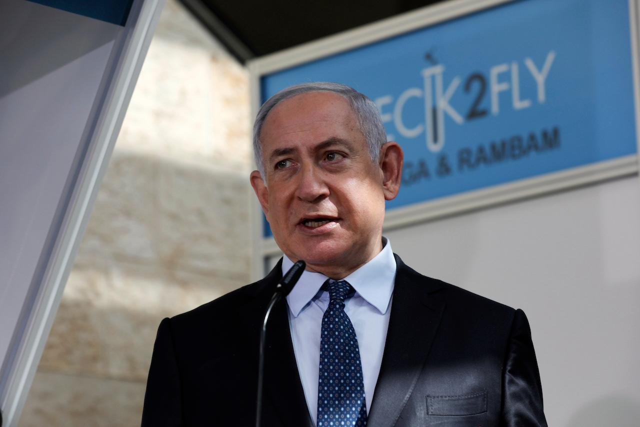 Israeli Prime Minister Benjamin Netanyahu visits a new coronavirus lab at Ben-Gurion International Airport, near Tel Aviv, Israel on Nov 9. Israeli media reported Nov 23 that Netanyahu flew to Saudi Arabia for a clandestine meeting with Crown Prince Mohammed bin Salman, which would mark the first known encounter between senior Israeli and Saudi officials. Photo: AP