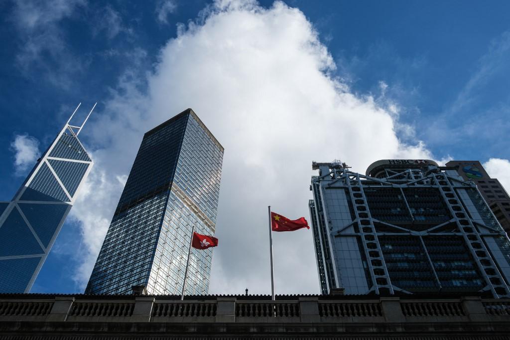 The Chinese national flag (centre right) and the Hong Kong flag hoisted on poles outside the Court of Final Appeal in Hong Kong. Photo: AFP