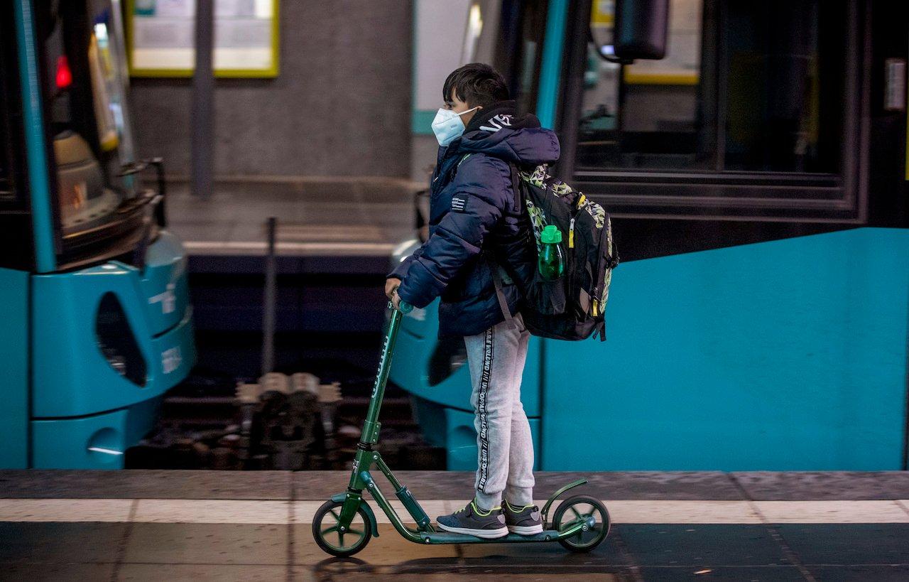 A boy passes a subway train in Frankfurt, Germany, Nov 25. Photo: AP