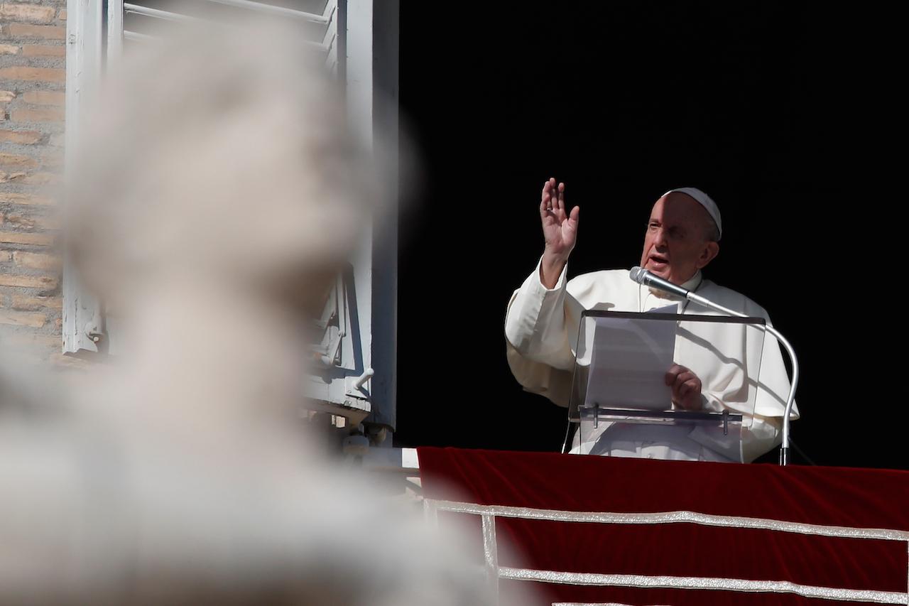 Pope Francis delivers a blessing during the Angelus noon prayer from the window of his studio overlooking St Peter's Square at the Vatican, Nov 22. Photo: AP