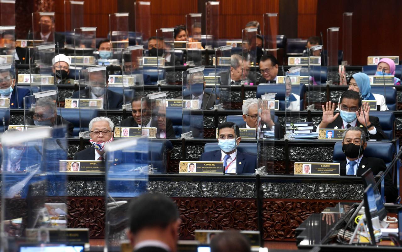 MPs react in the Dewan Rakyat today where the budget bill was passed by voice vote. Photo: Bernama