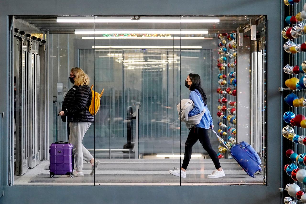 Travellers walk through Terminal 3 at O'Hare International Airport in Chicago, Nov 29. Photo: AP
