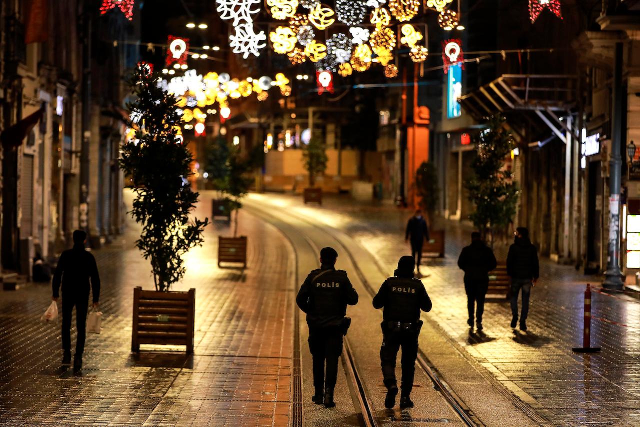 Police officers patrol the main shopping street in Istanbul on Nov 21, minutes into a lockdown, part of the new measures to try curb the spread of the coronavirus. Photo: AP