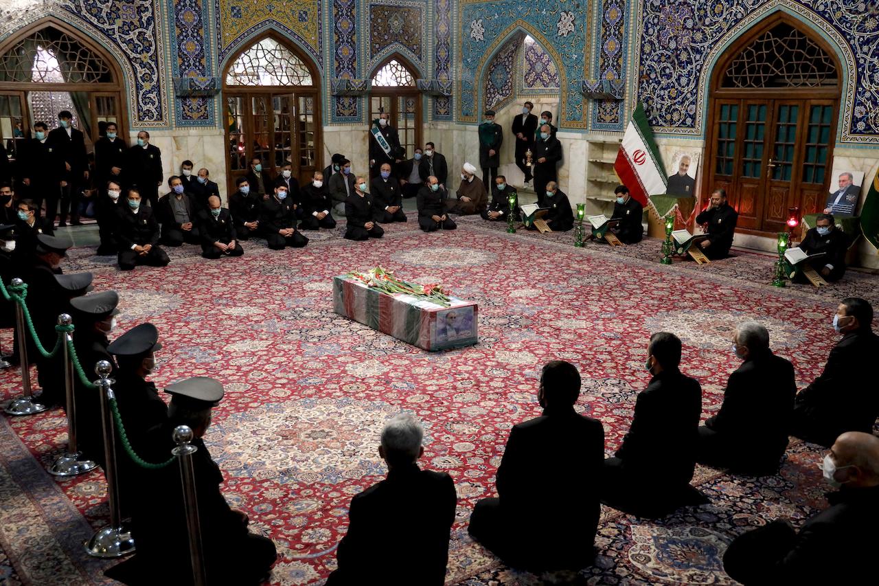 People pray over the flag-draped coffin of Mohsen Fakhrizadeh, an Iranian scientist linked to the country's disbanded military nuclear programme, who was killed on Friday. Photo: AP