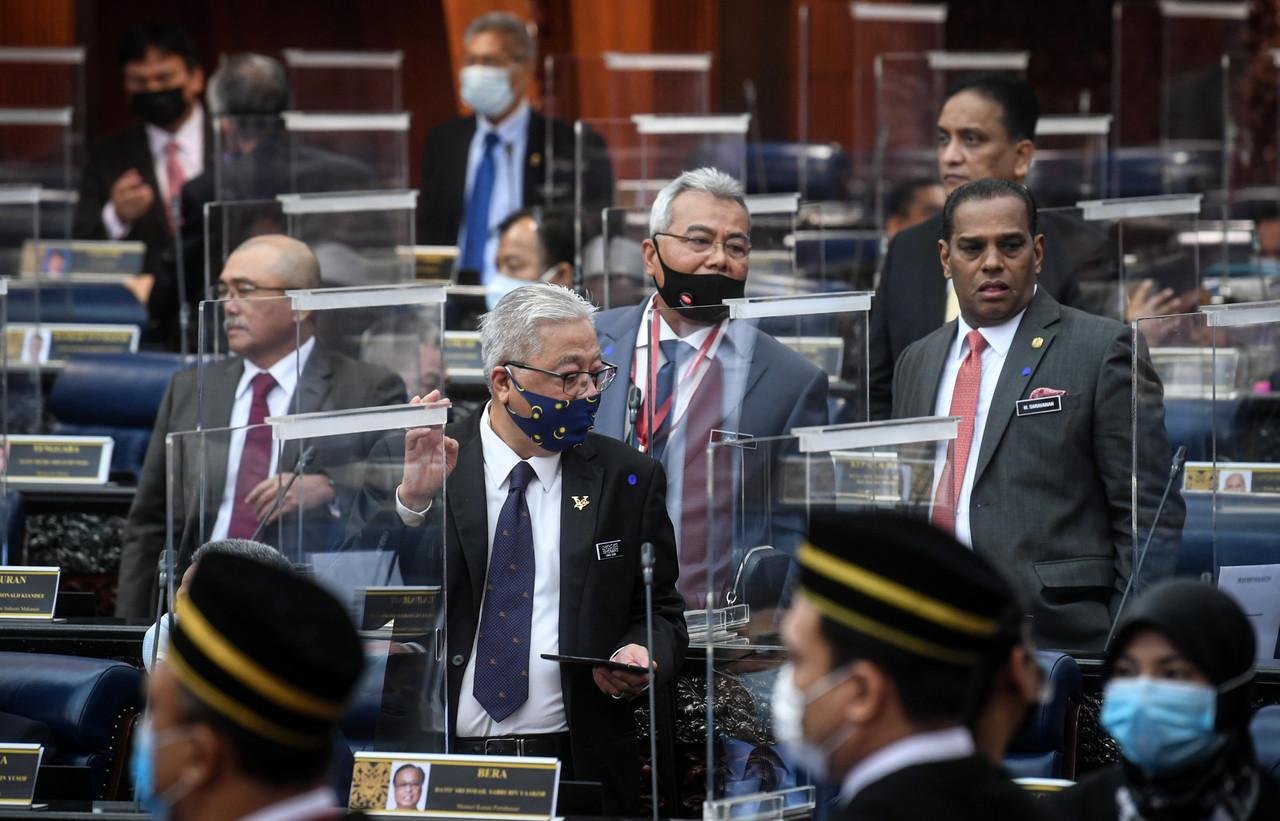 MPs react after the budget for the Prime Minister's Office is passed by bloc vote in the Dewan Rakyat. Photo: Bernama