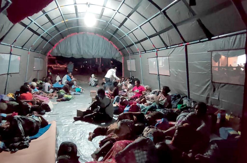 Evacuees at a makeshift shelter after Mount Ili Lewotolok erupted spewing a column of smoke and ash 4000m high, in Lembata, East Nusa Tenggara. Photo: AFP