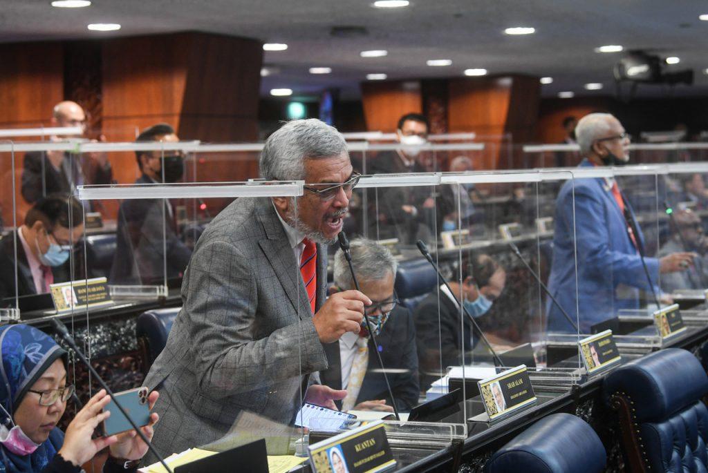 Amanah's Shah Alam MP Khalid Samad (left) and others react during the bloc vote on the budget for the Prime Minister's Department in the Dewan Rakyat yesterday. Photo: Bernama