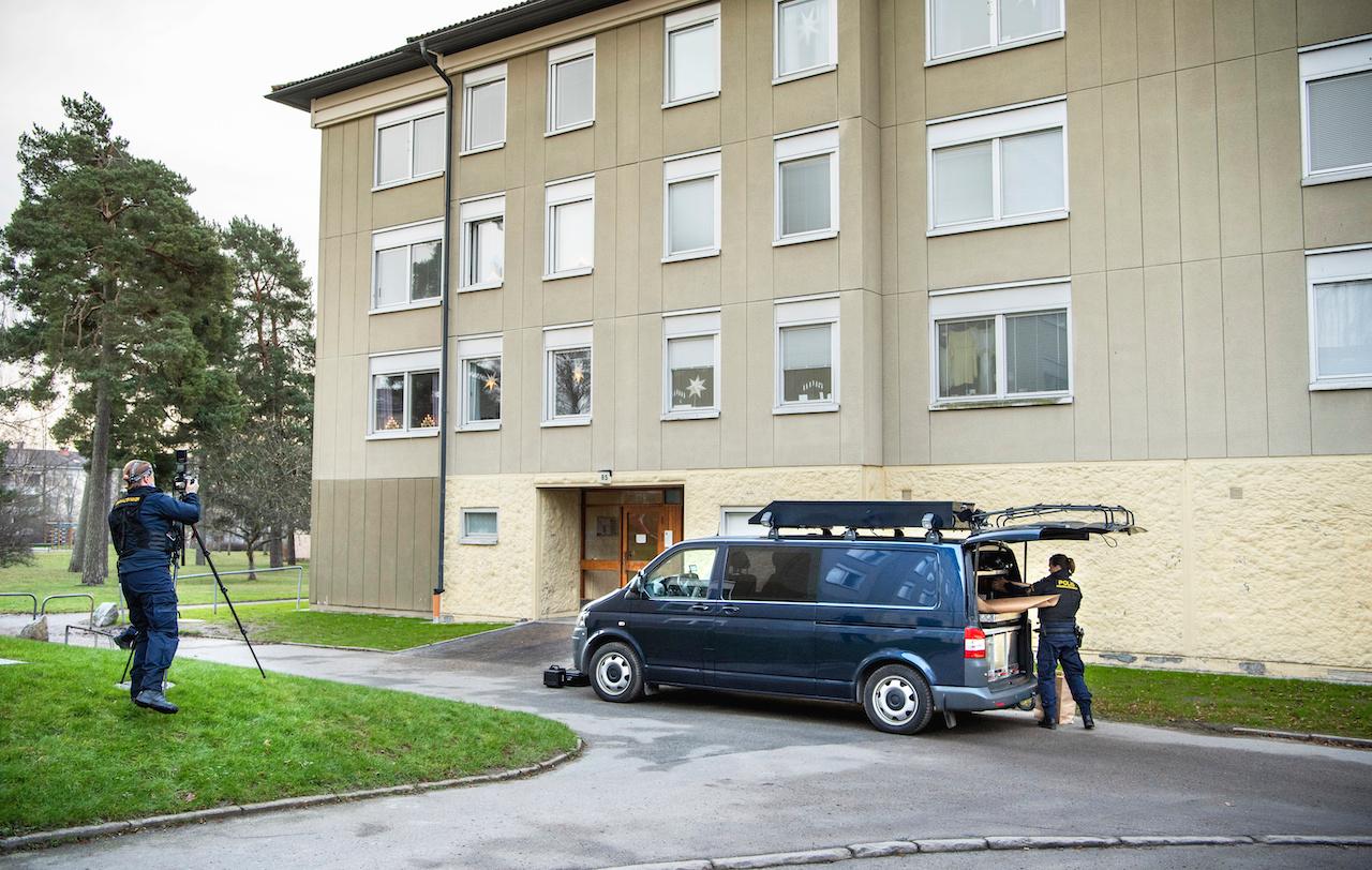 Police at the scene of an apartment where a woman is suspected of keeping her son locked up, in Haninge, south of Stockholm, Dec 1. Photo: AP