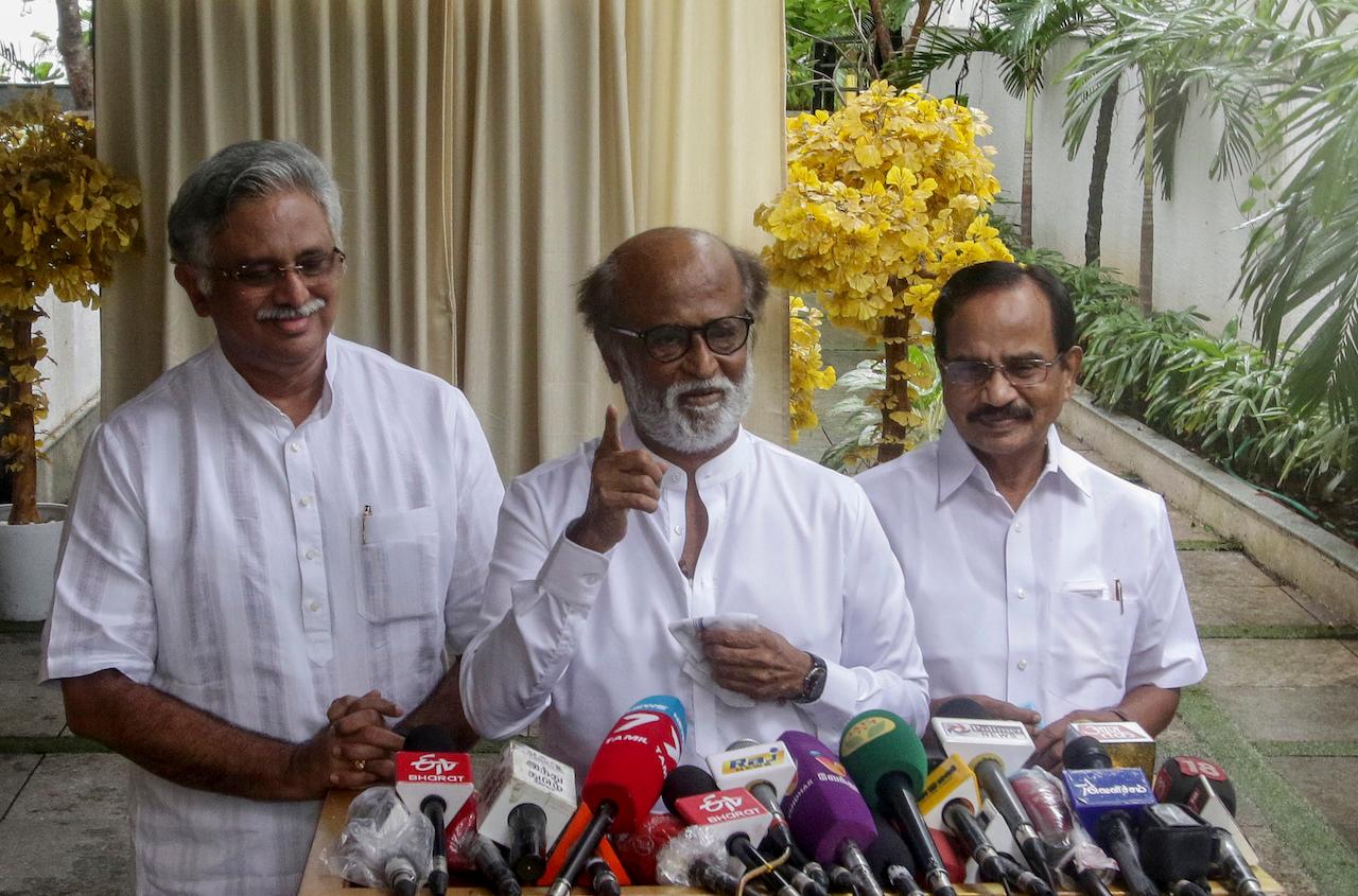Indian movie superstar Rajinikanth (center) addresses a press conference outside his residence in Chennai, India, Dec 3. Photo: AP