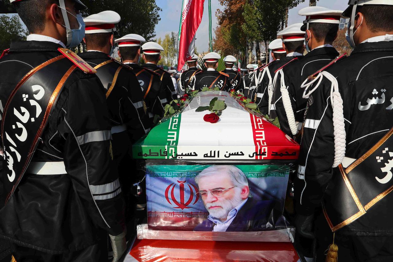 Military personnel stand near the flag-draped coffin of Mohsen Fakhrizadeh during a funeral ceremony in Tehran, Iran, Nov 30. Photo: AP