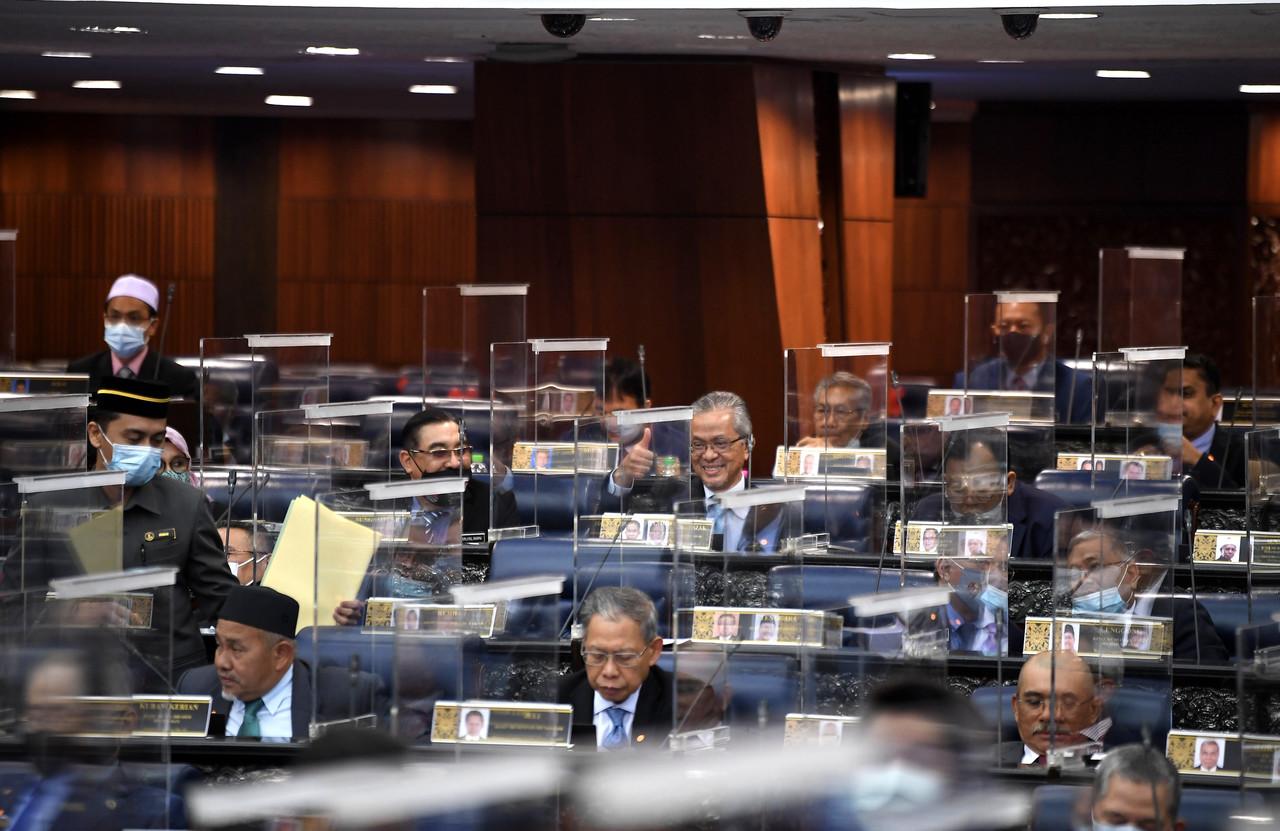 MPs react in the Dewan Rakyat as the committee-level debate on the budget for 2021 continues. Photo: Bernama