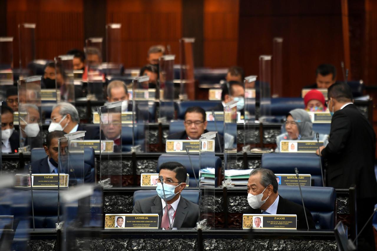 MPs including Prime Minister Muhyiddin Yassin in the Dewan Rakyat as the committee-stage debate on the 2021 budget continues. Photo: Bernama