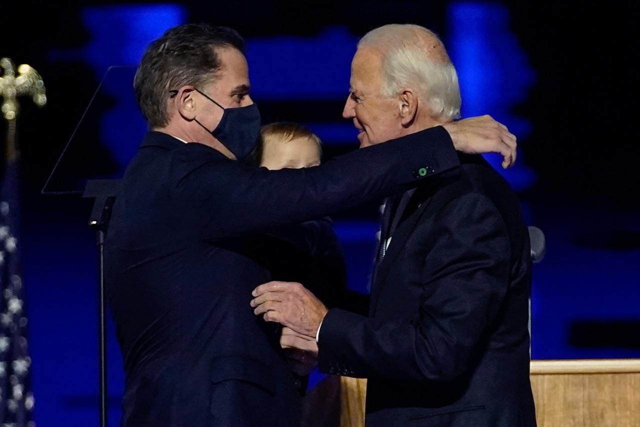 President-elect Joe Biden (right) embraces his son Hunter Biden (left) in Wilmington, Delaware on Nov 7. Photo: AP