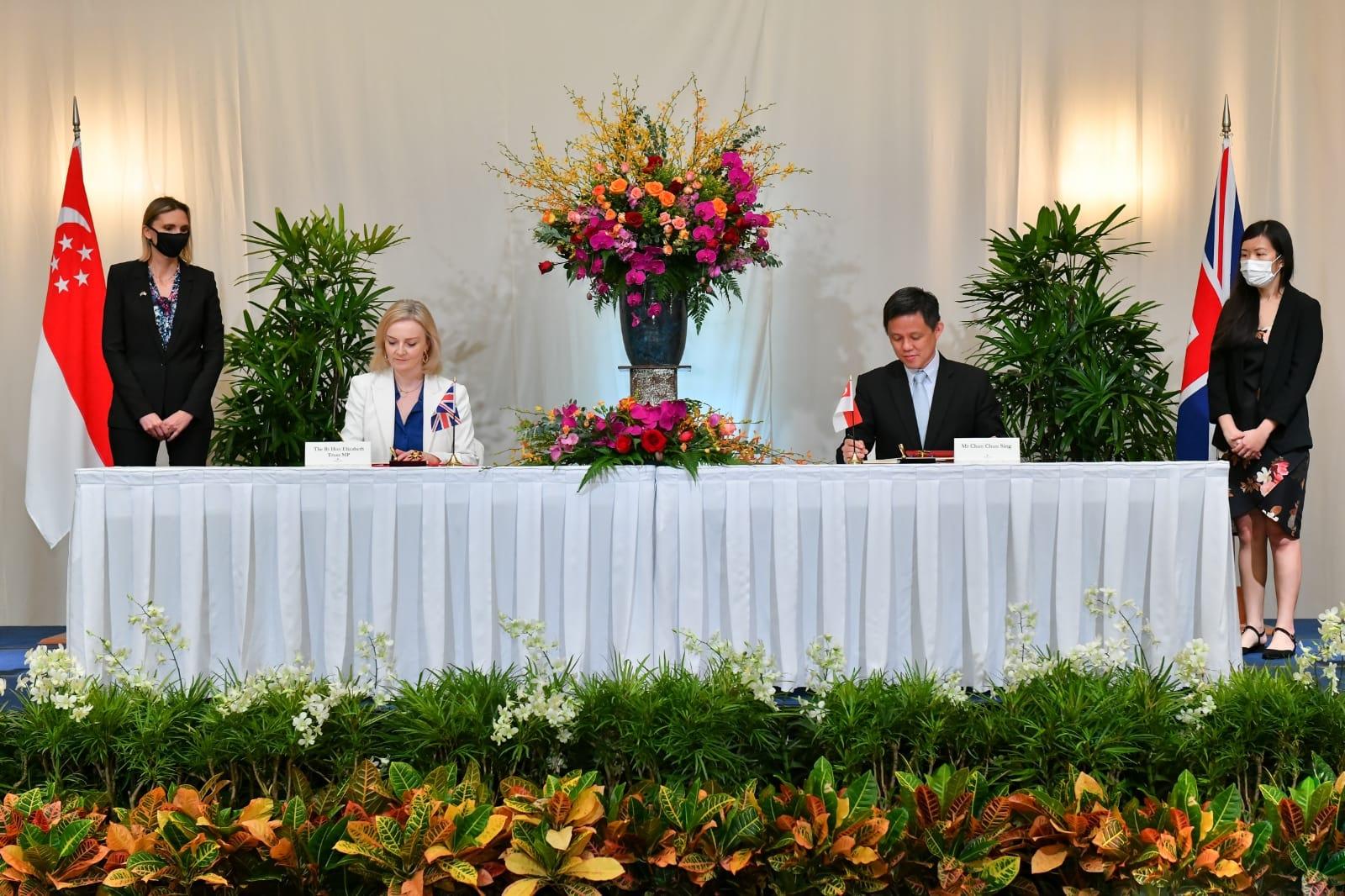 Britain's trade minister Liz Truss and her Singapore counterpart Chan Chun Sing sign the UK-Singapore Free Trade Agreement in Singapore today. Photo: Facebook