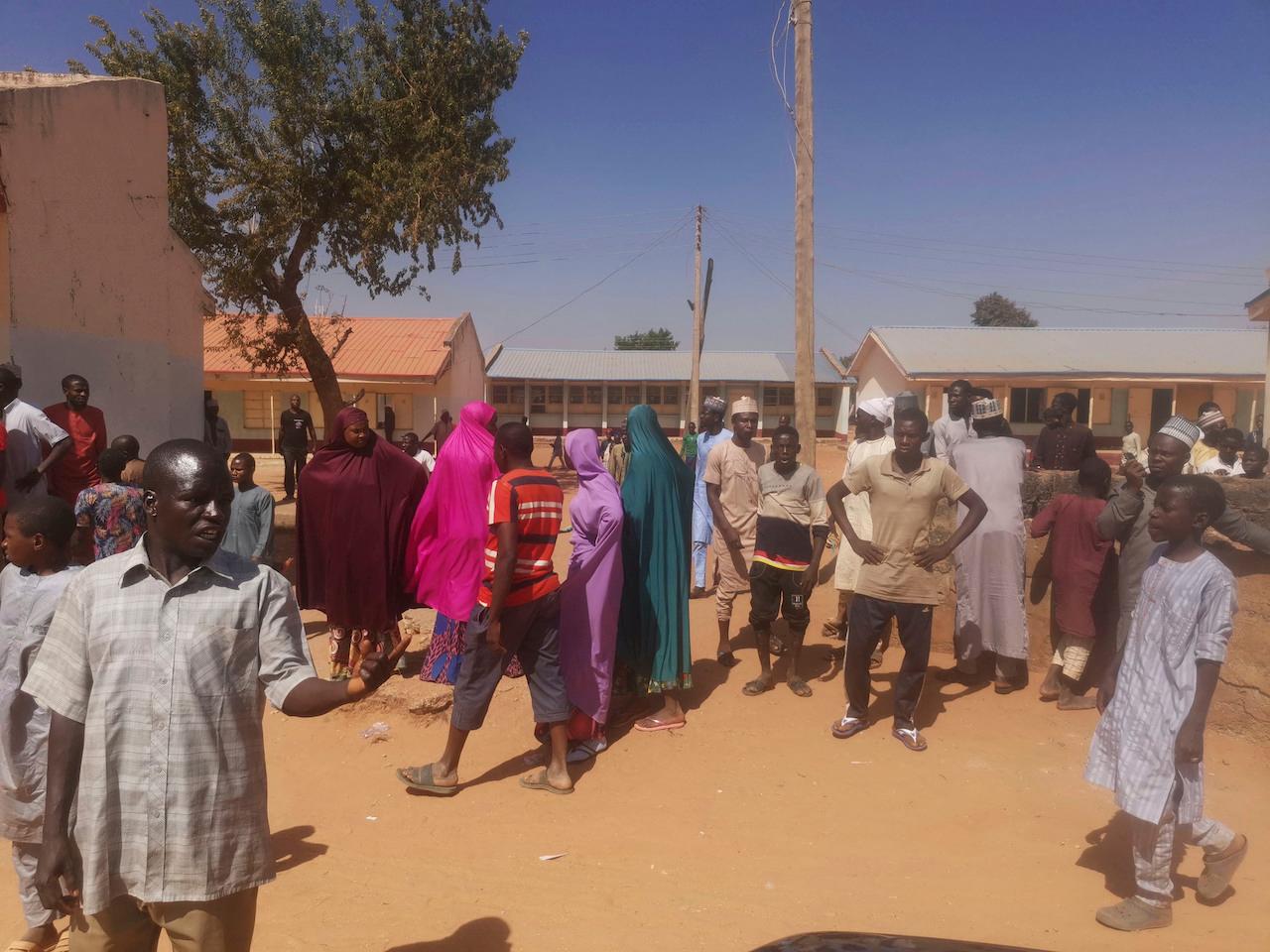 People gather at the Government Science Secondary School in Kankara, Nigeria, Dec 12. Photo: AP