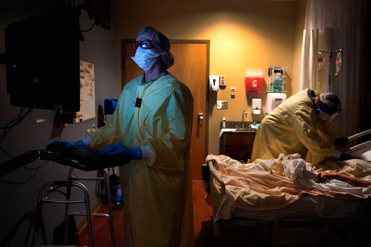 Healthcare workers check on a Covid-19 patient at a hospital in Memphis. Photo: AP