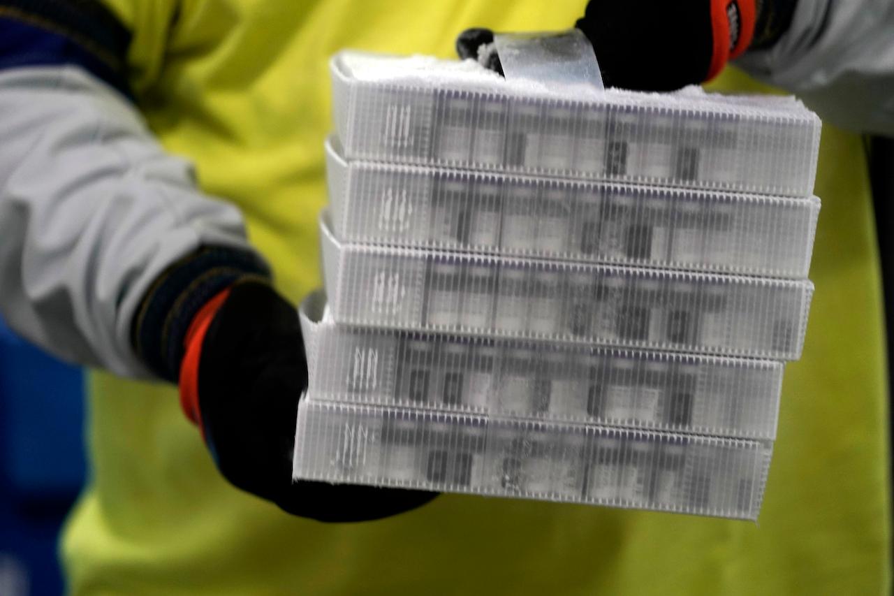 Boxes containing the Pfizer-BioNTech Covid-19 vaccine are prepared to be shipped at the Pfizer Global Supply Kalamazoo manufacturing plant in Michigan. The government says a final decision on the use of the vaccine will be up to the National Pharmaceutical Regulatory Agency. Photo: AP