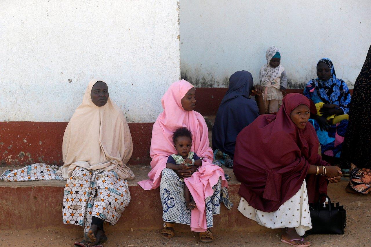 Parents of the missing Government Science secondary school students wait for news on their children in Kankara , Nigeria, Dec 16. Photo: AP