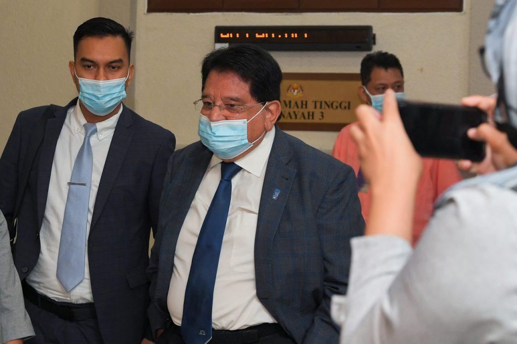 Former federal territories minister Tengku Adnan Tengku Mansor leaves the Kuala Lumpur court complex after a hearing earlier this month. Photo: Bernama