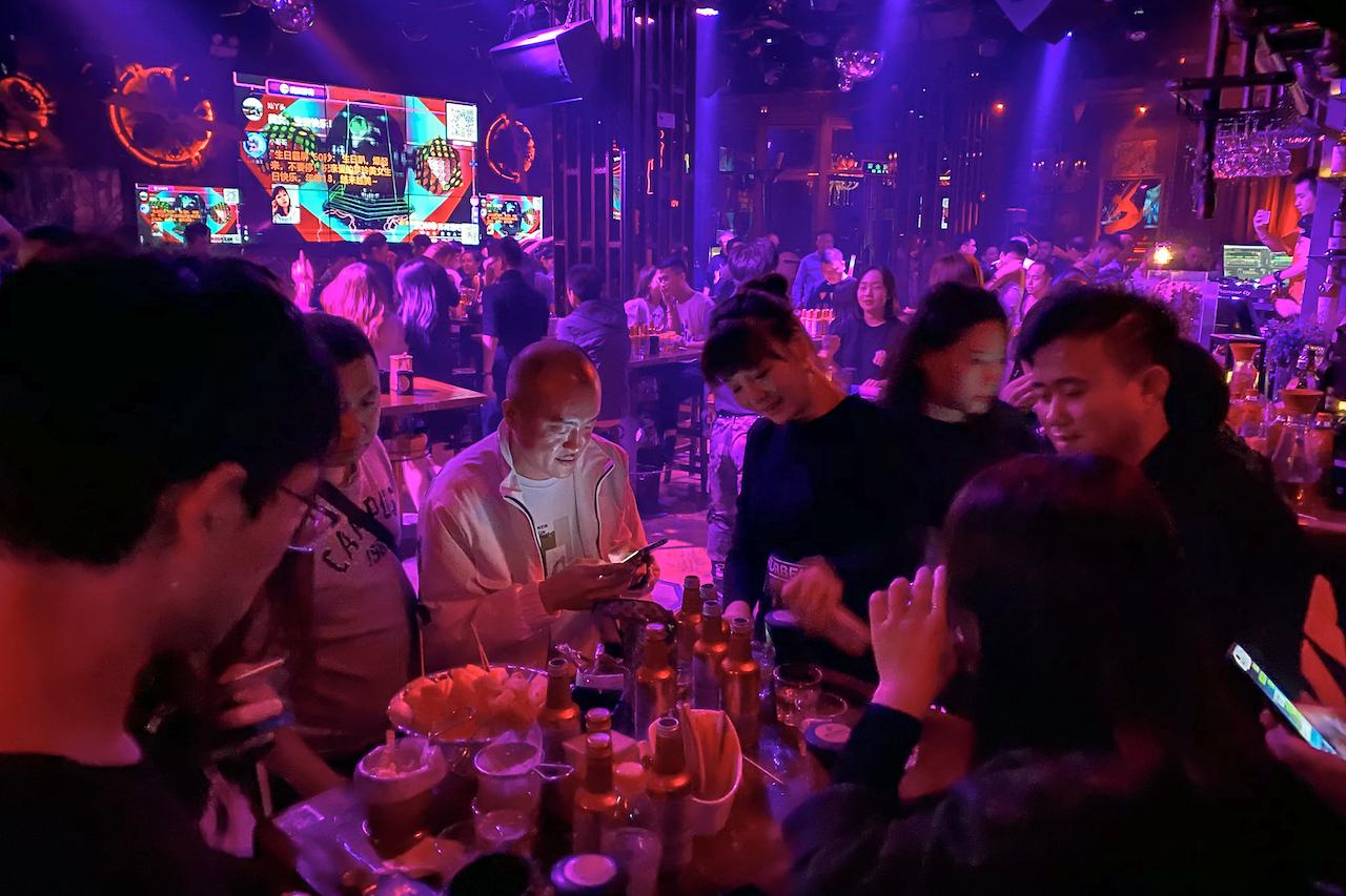 Residents enjoy night life at a club in Wuhan in central China's Hubei province, Oct 18. China has largely curbed the spread of the virus, and was one of the only major economies to report growth this year. Photo: AP