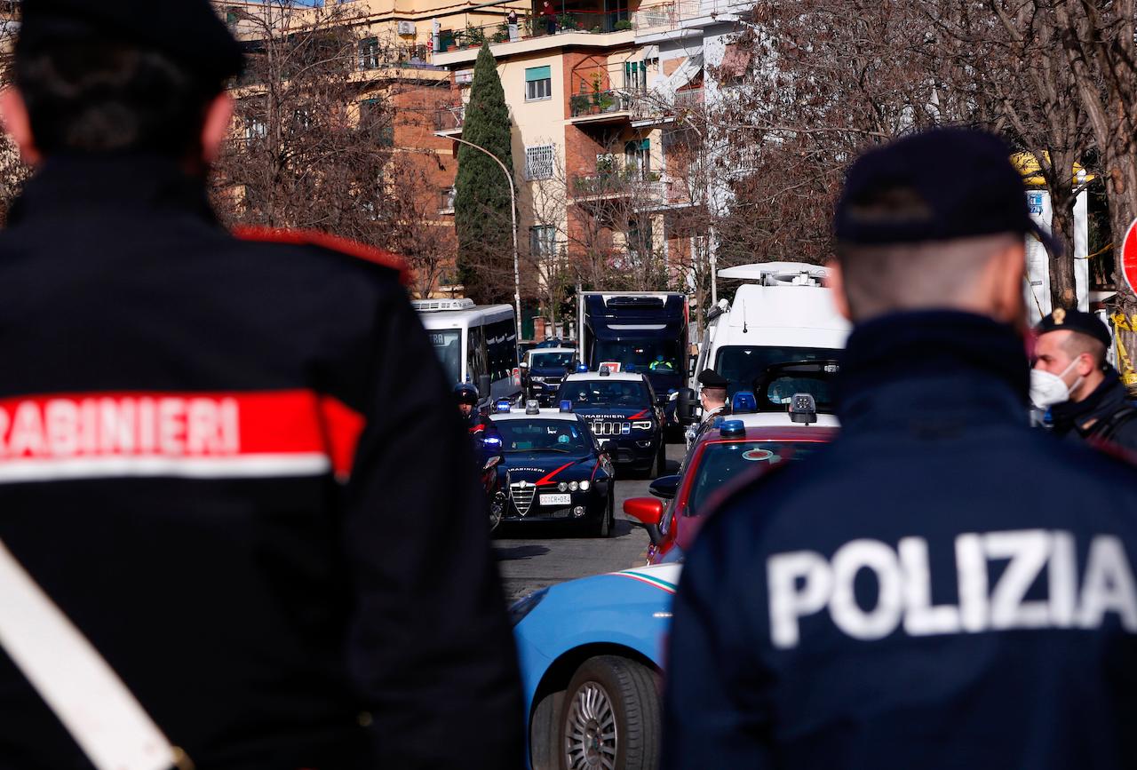 Italian police escort a refrigerated truck carrying the first doses of Covid-19 vaccine in Rome, Dec 26. Photo: AP