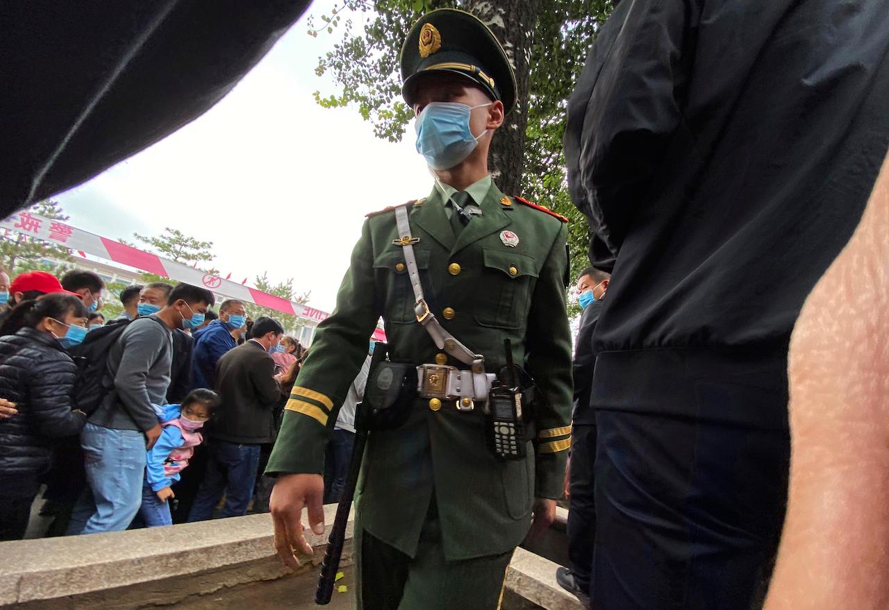 A Chinese paramilitary police officer stands on duty at the Tiananmen area in Beijing, Oct 1. Violent crime is relatively rare in China, but the country has seen a rise in knife attacks in recent years. Photo: AP