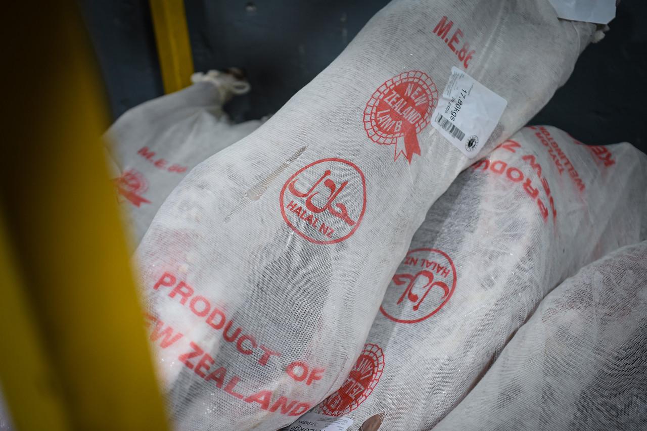 Sacks of frozen meat bearing the halal logo seen at a warehouse in Kuala Lumpur. The police say they will assist the government's investigation into the case involving claims of imported meat repackaged with fake halal labels. Photo: Bernama