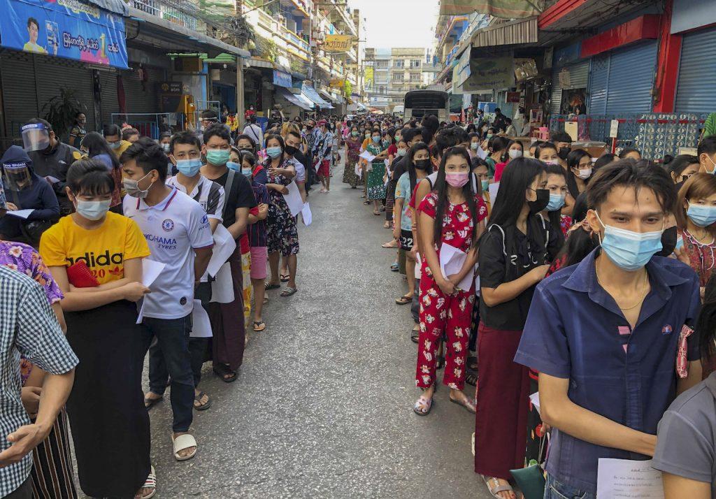 People queue to get Covid-19 tests in Samut Sakhon, Thailand, Dec 20. More than 1,500 cases were recently reported, most of which were linked to migrant workers at a seafood market there. Photo: AP