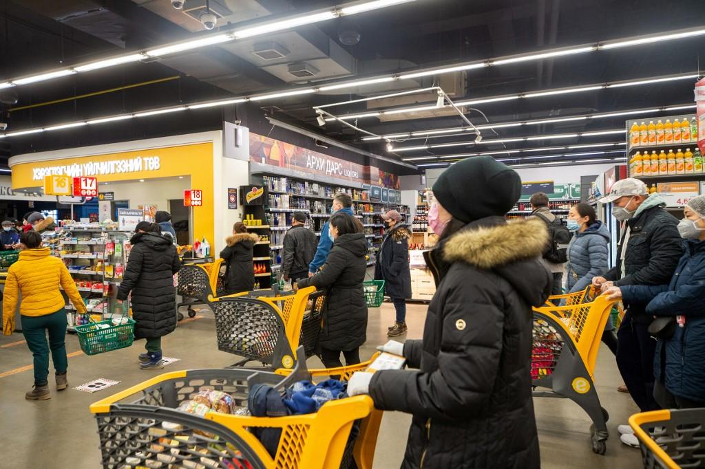 Customers wearing face masks observe social distancing rules at a supermarket in Ulaanbaatar, the capital of Mongolia. Photo: AFP
