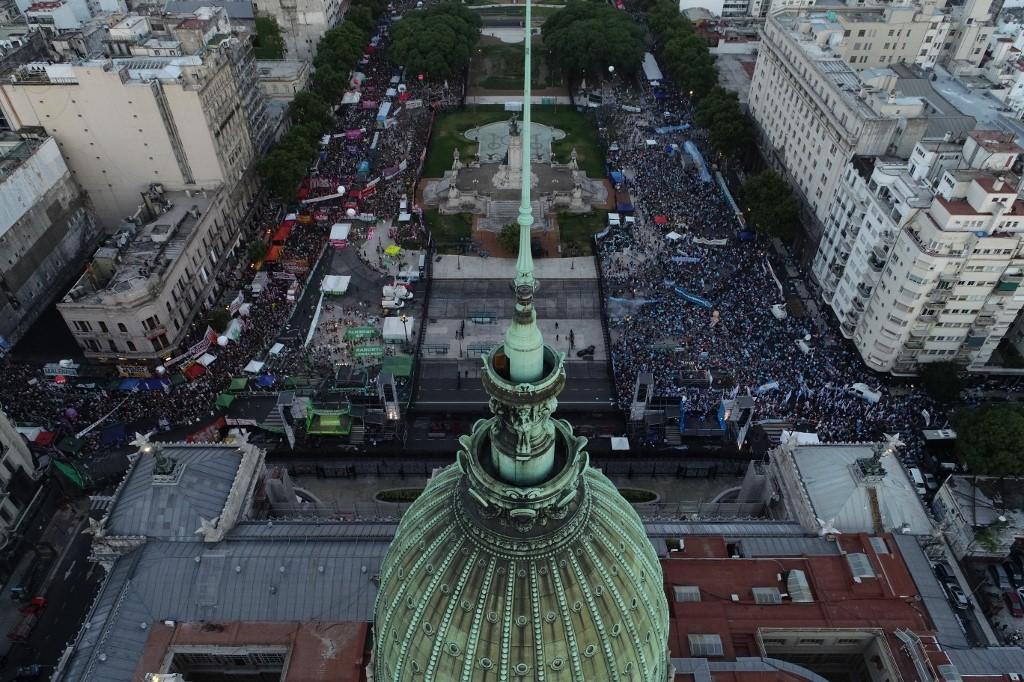 Anti-abortion activists (right) and abortion rights supporters (left) gather outside the Argentine Congress as senators debate a landmark bill on whether to legalise abortion in Buenos Aires. Photo: AFP