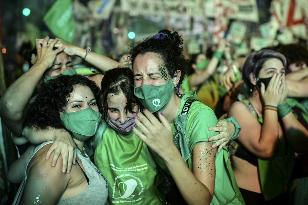 Pro-choice activists celebrate after the Senate approved a bill to legalise abortion outside the Congress in Buenos Aires on Dec 30. Photo: AFP