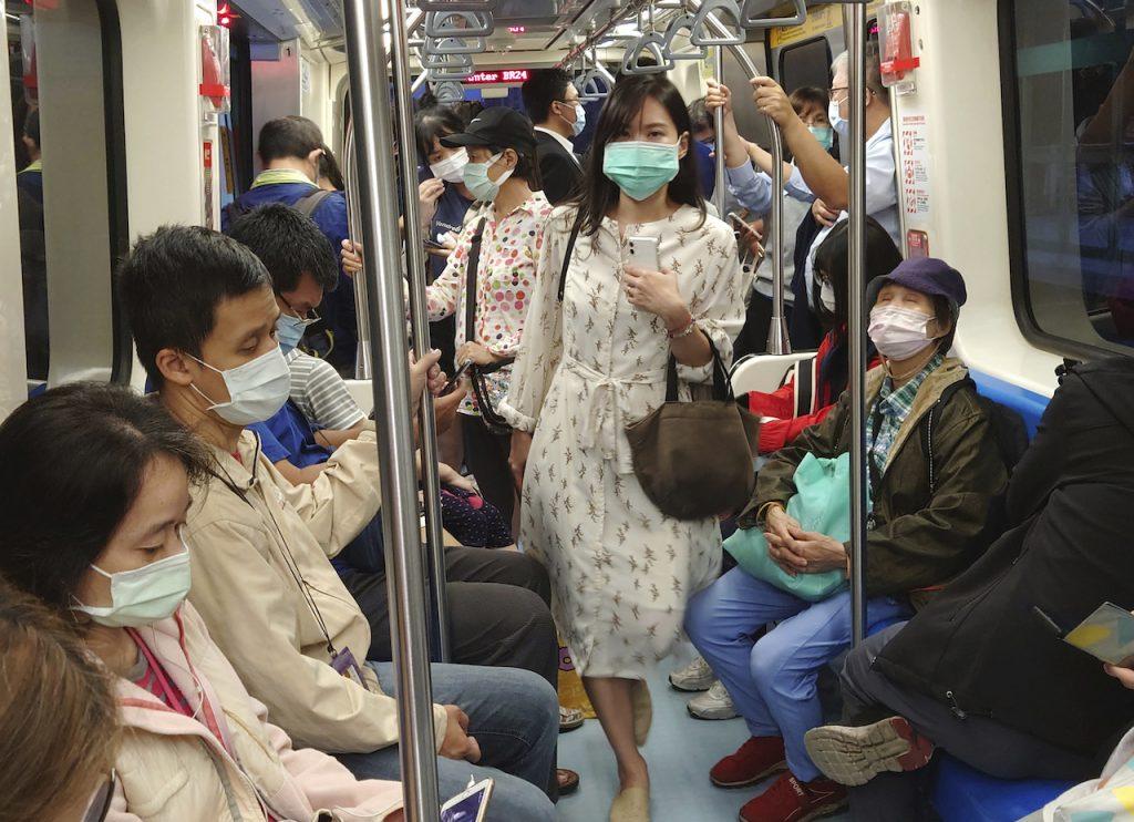Passengers on the public metro wear face masks to help curb the spread of the coronavirus in Taipei, Taiwan, Nov 16. Photo: AP